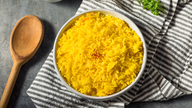 bowl of saffron rice with spoon