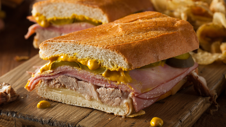 A Cuban sandwich with dripping mustard