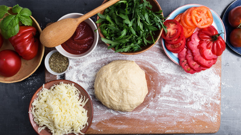 Ingredients for pizza on table