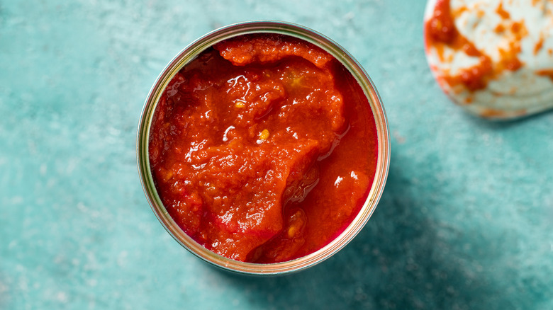 Can of opened tomato sauce