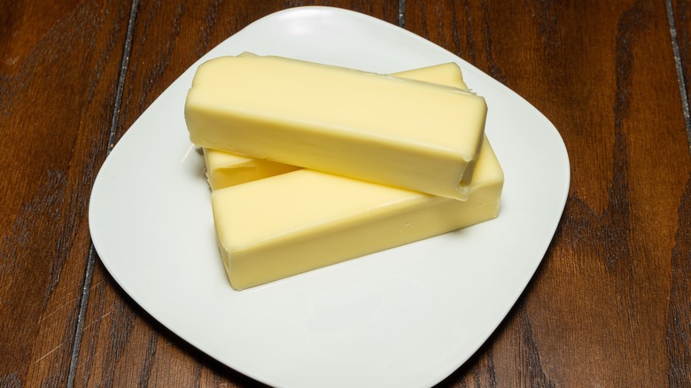 Sticks of soft butter on a plate
