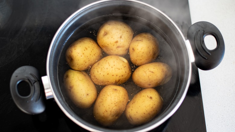 Potatoes boiling with skins on