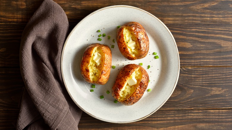 Baked potatoes on white plate