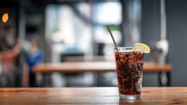 Glass of soda on a café table