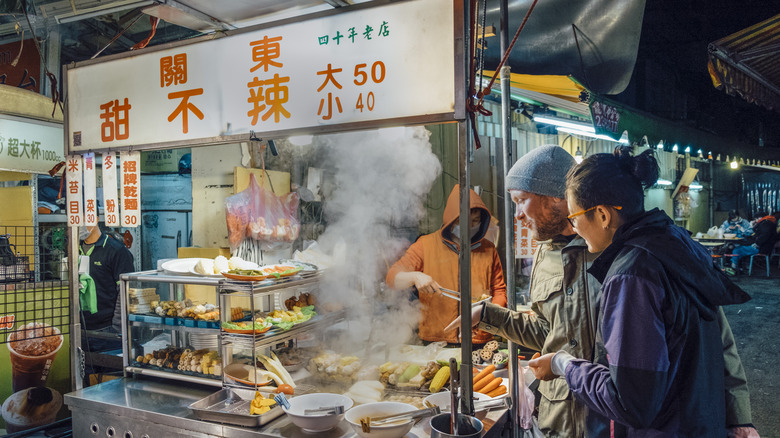 Couple buying street food