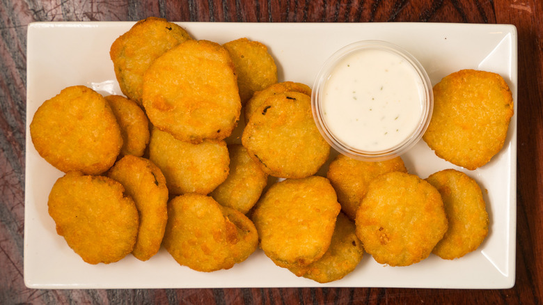 plate of deep fried pickles with ranch