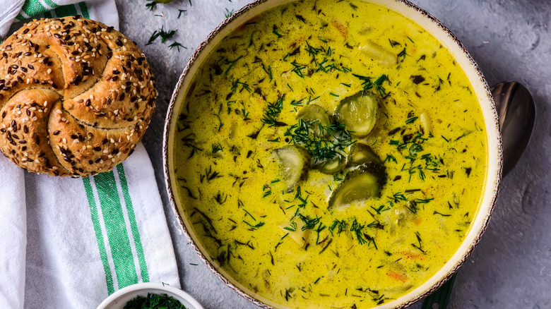 bowl of pickle soup and bread roll