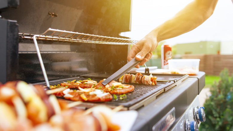 Man grilling on gas grill