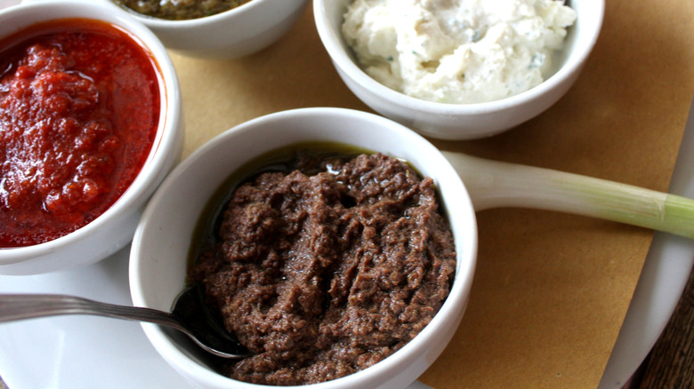 Bowl of anchovy paste with other condiments
