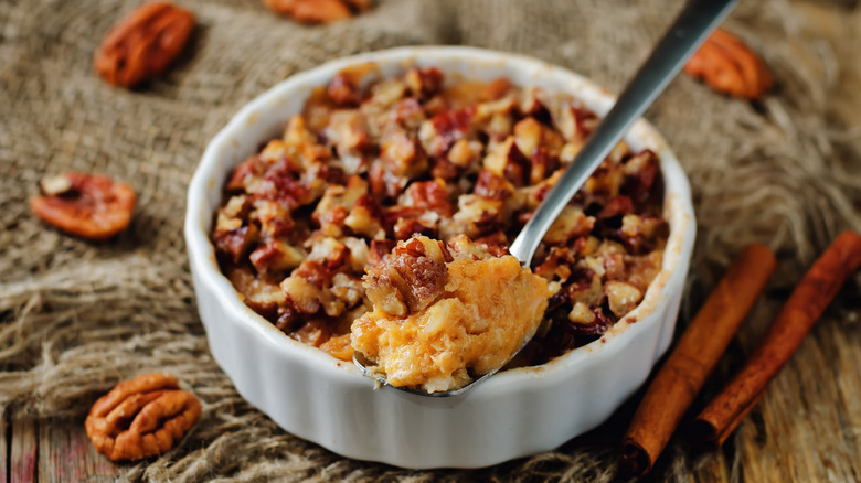 sweet potatoes and pecans with spoon