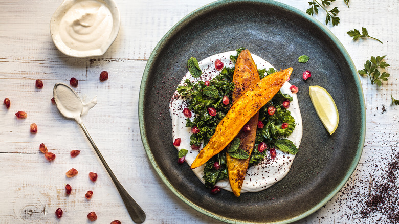 sweet potatoes on whipped goat cheese