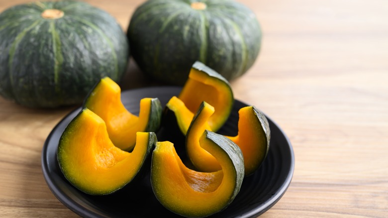 Whole and sliced Kabocha pumpkin