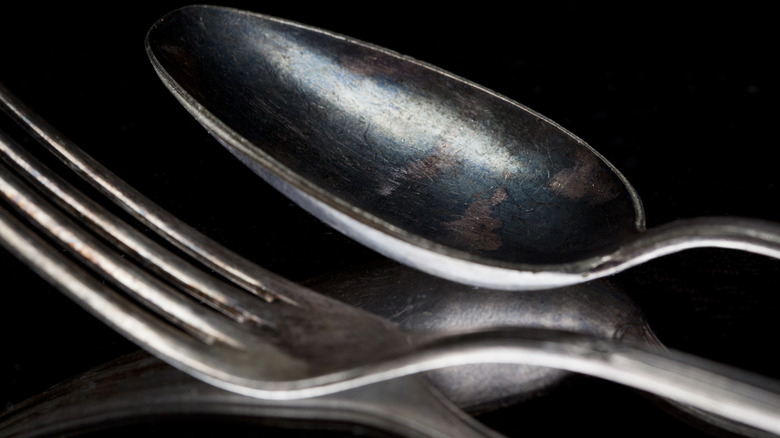 tarnished silver spoon and fork