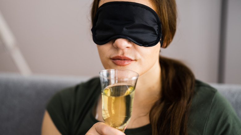 Woman blind tasting wine