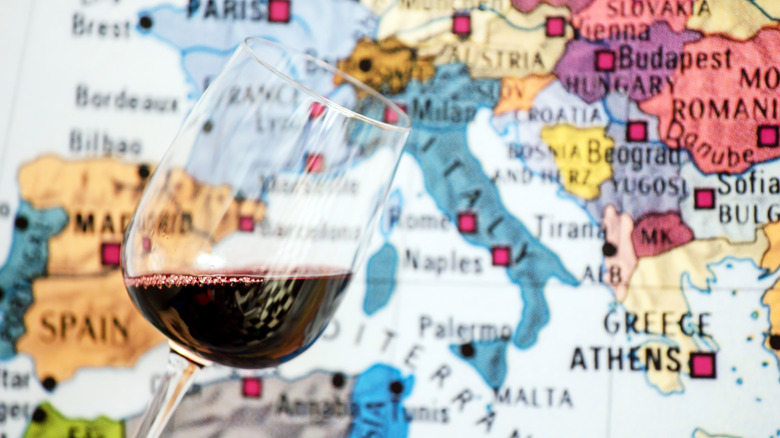 Glass of wine against a map