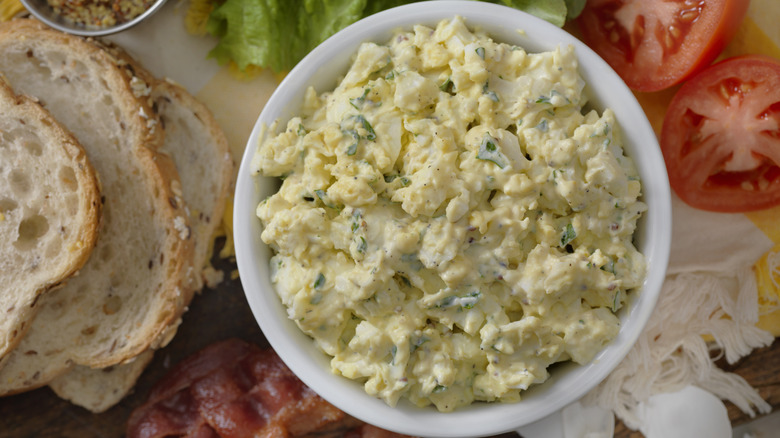 egg salad in a bowl with ingredients