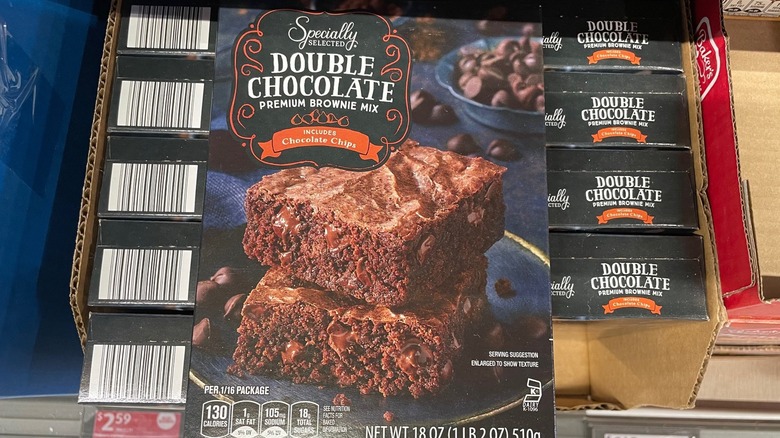 A box of Aldi brownie mix is a display box at the store.