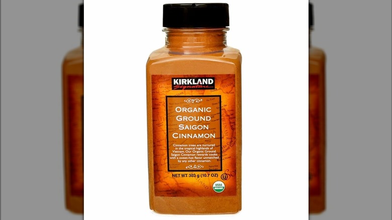 A jar of Kirkland Signature organic ground Saigon cinnamon on a white background