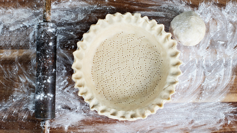 Pie crust in pan with crimped edges