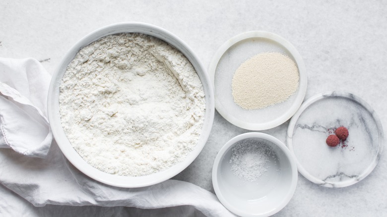 Bowls full of baking ingredients on countertop