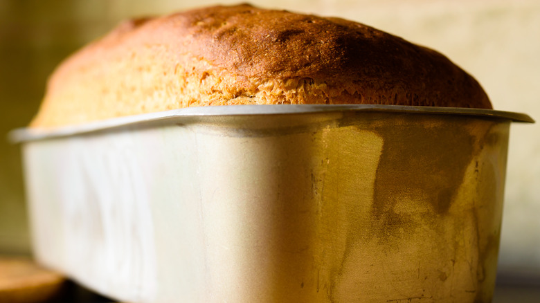 Freshly baked bread in metal loaf pan