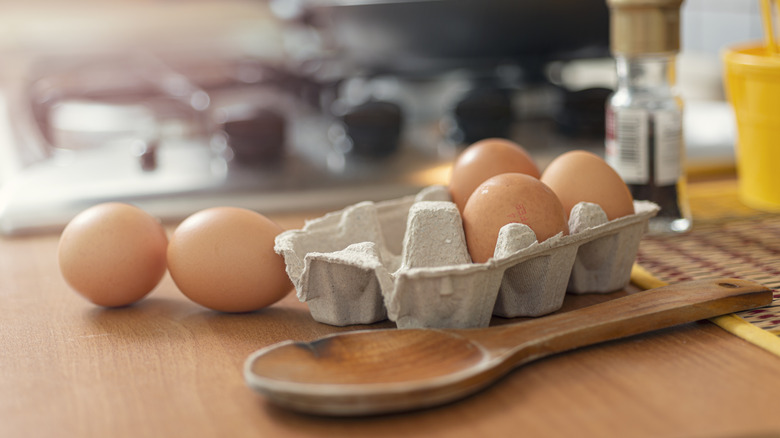 Half carton of eggs on counter