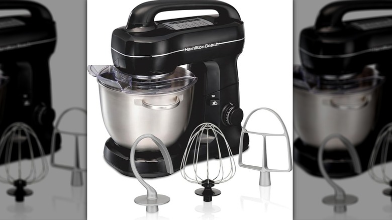 Black Hamilton Beach stand mixer with attatchments displayed