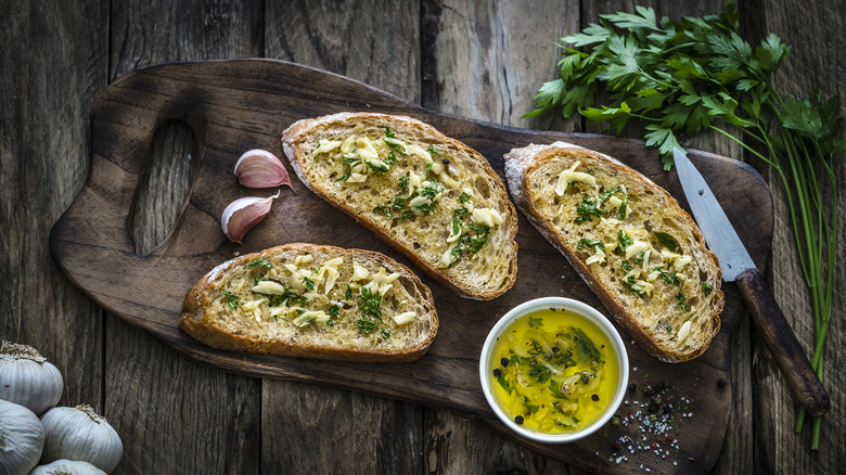 Garlic bread on wooden board