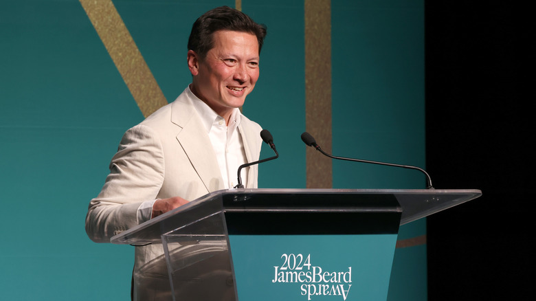 J. Kenji López-Alt behind a podium at the James Beard Awards