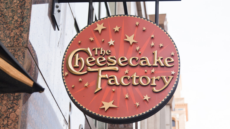 a neon sign of Cheesecake Factory