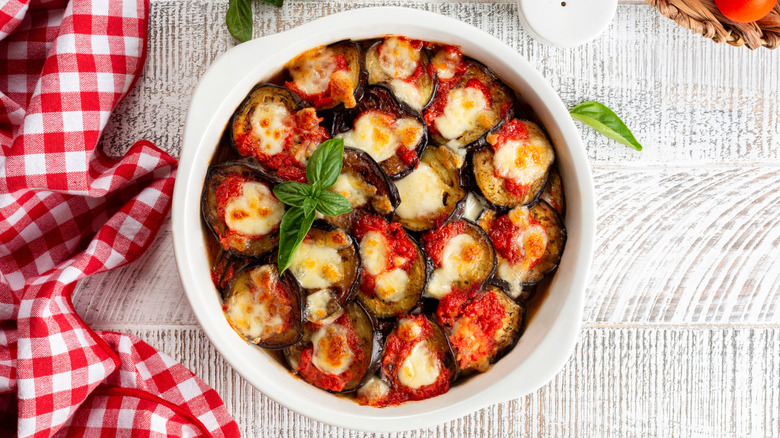 Baked eggplant casserole in white dish