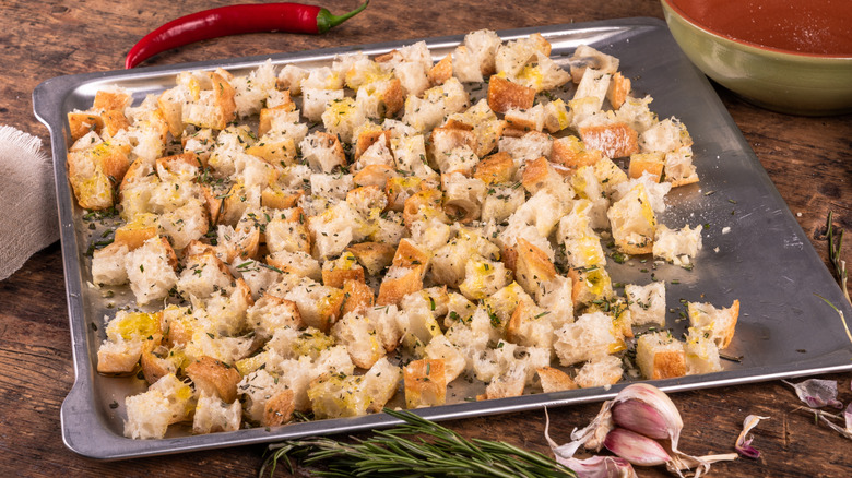 Ciabatta croutons on metal pan ready for baking