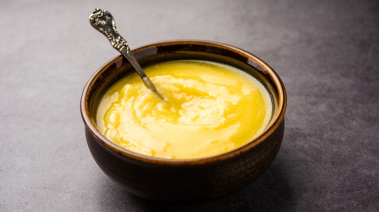 Clarified butter with spoon