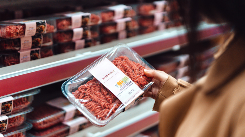 Woman holding ground beef