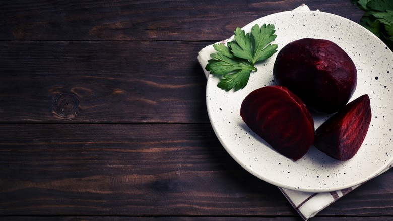 Boiled beetroot on white plate