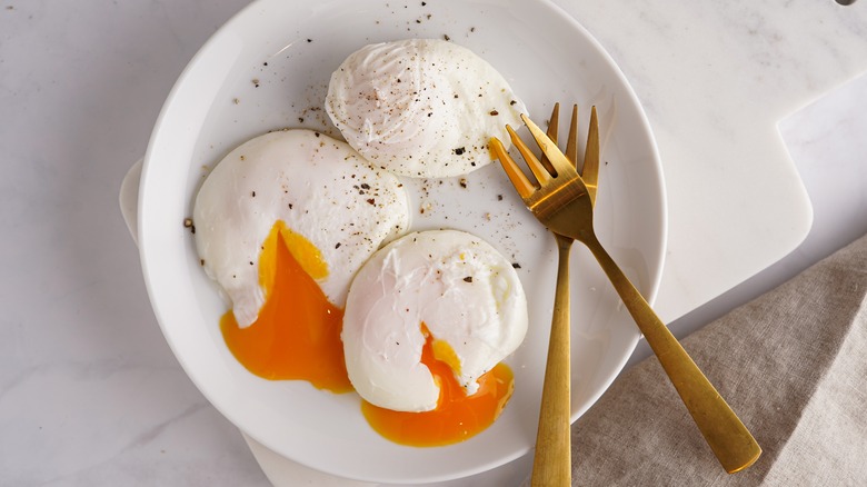 Poached eggs with runny yolk