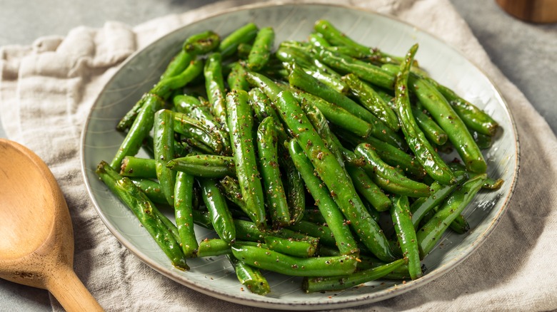 Green beans on white plate