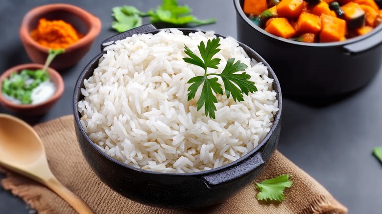 Boiled rice in black bowl