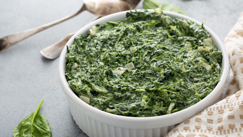 Creamed spinach in white bowl