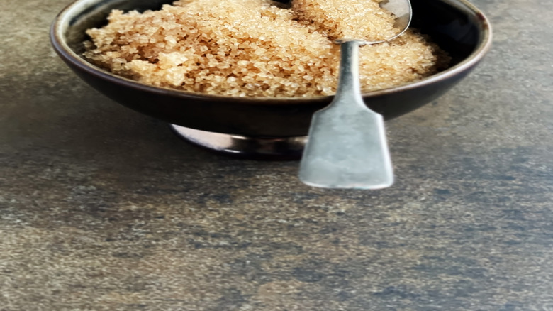 Bowl of brown sugar with spoon