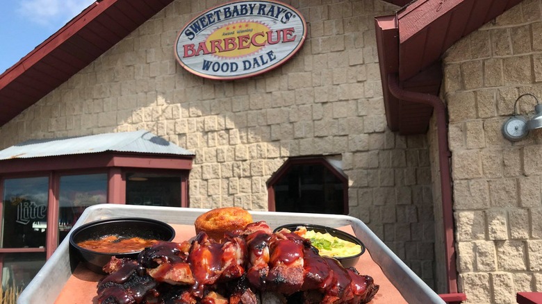 Sweet Baby Ray's Barbecue restaurant with tray of food