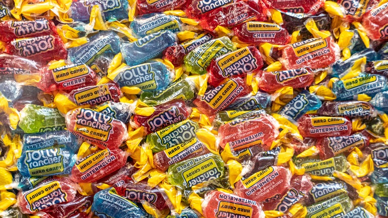 Texture shot of assorted wrapped Jolly Rancher candies