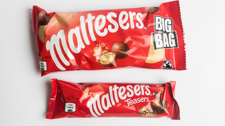 Bags of Maltesers on white background