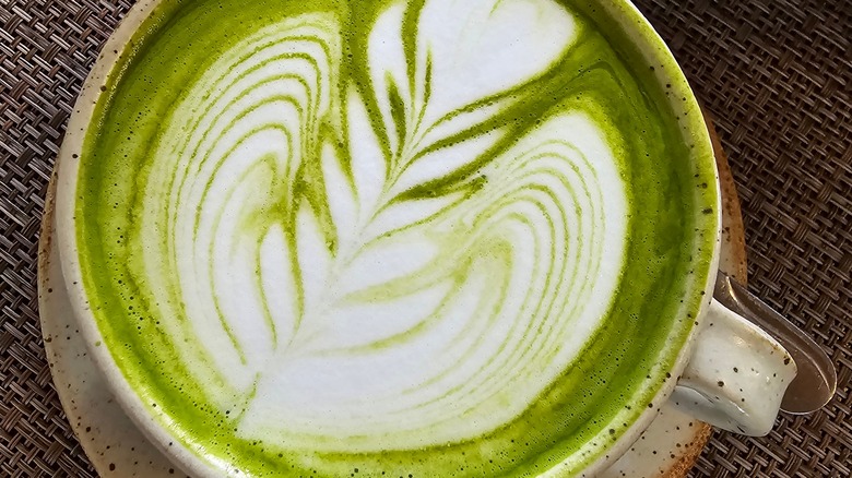 Overhead shot of a matcha drink with milk