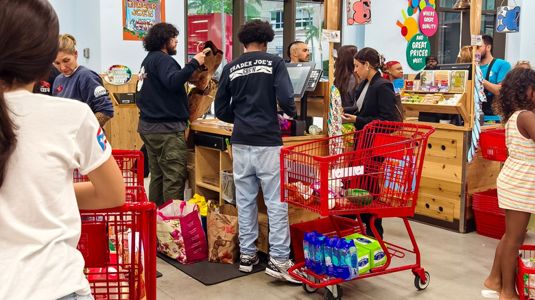 Trader Joe's crew member bagging groceries