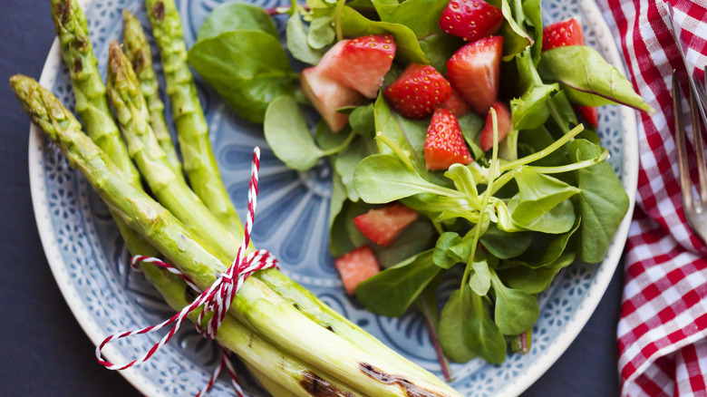 asparagus, strawberries, and watercress leaves