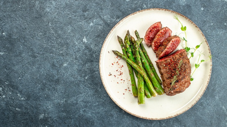 asparagus and steak on plate