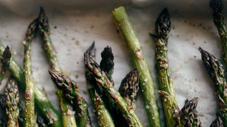 overcooked asparagus tips on pan