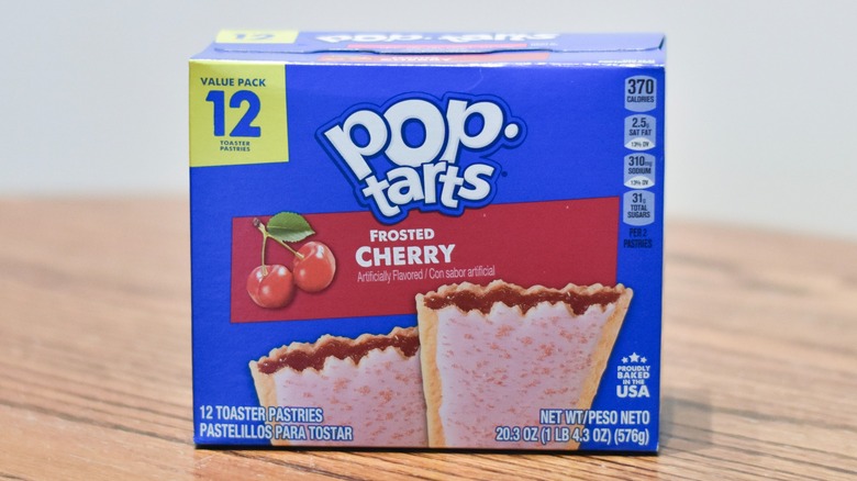 A box of Cherry Pop Tarts on a wooden table