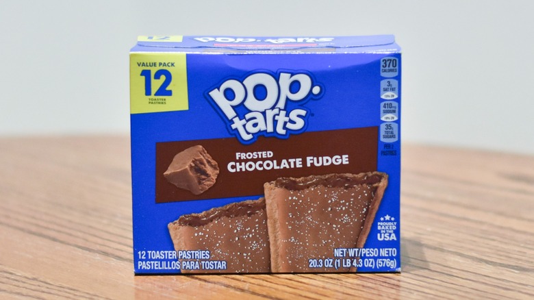 A box of Chocolate Fudge Pop Tarts on a wooden table